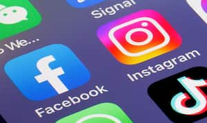 PARIS, FRANCE - FEBRUARY 20: In this photo illustration, the logos of social media applications, Facebook and Instagram are displayed on the screen of an iPhone on February 20, 2023 in Paris, France. Meta CEO Mark Zuckerberg announced on Sunday the launch of a paid subscription starting at $11.99 per month for users to authenticate their accounts on Meta platforms (Facebook, Instagram). The subscription will first roll out in Australia and New Zealand this week and resembles Twitter's model. (Photo illustration by Chesnot/Getty Images)